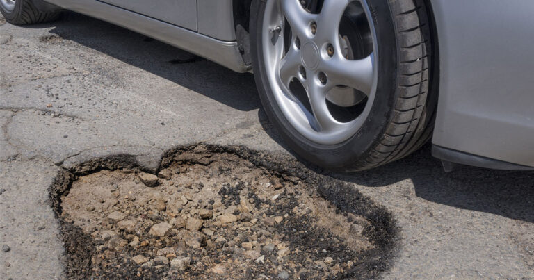 Car Damage After Hitting a Pothole | 618-277-3644
